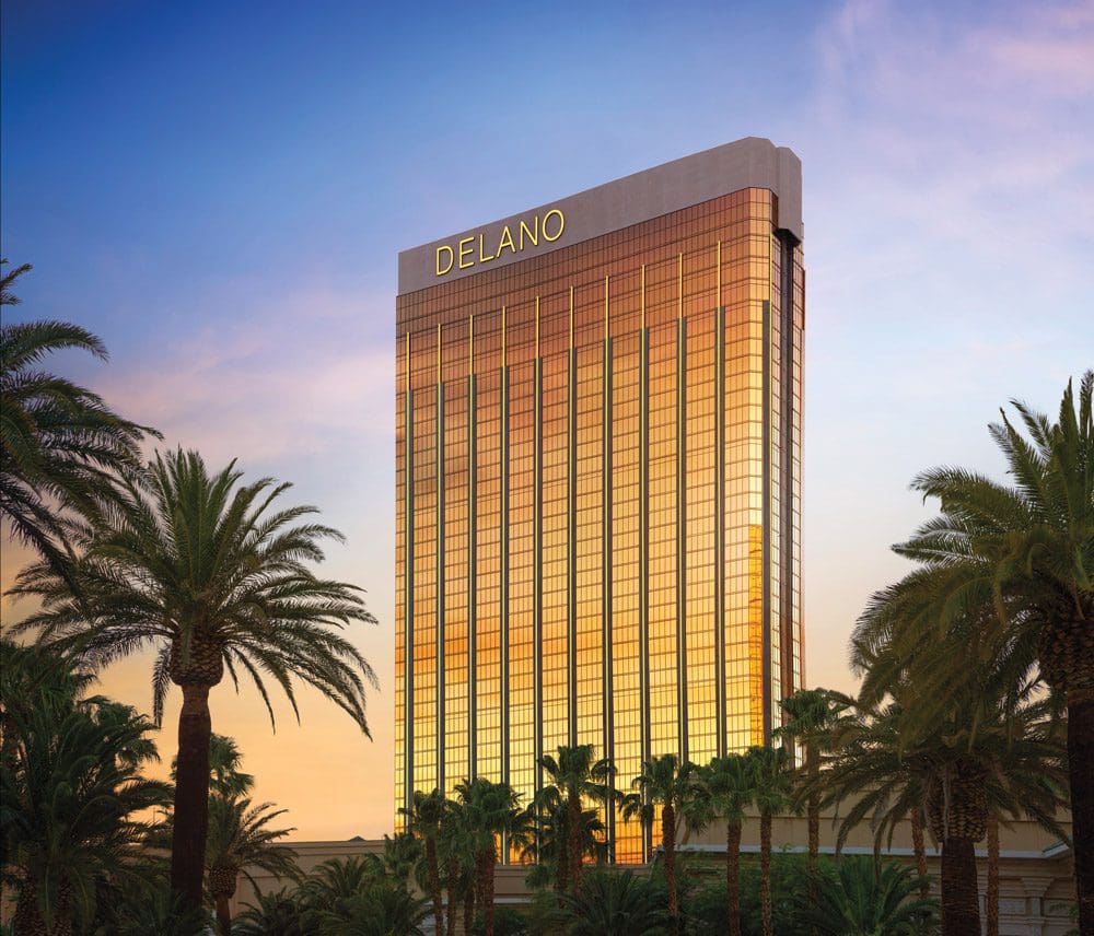 A view of the Delano exterior lit up by the setting sun, one of the best hotels in Las Vegas for families.
