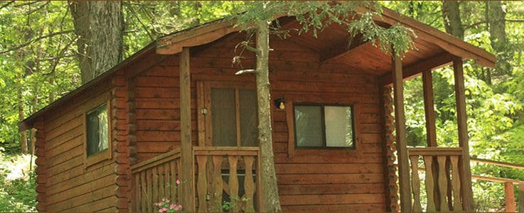 An exterior view of one of the rustic cabins at Odetah Camping Resort.