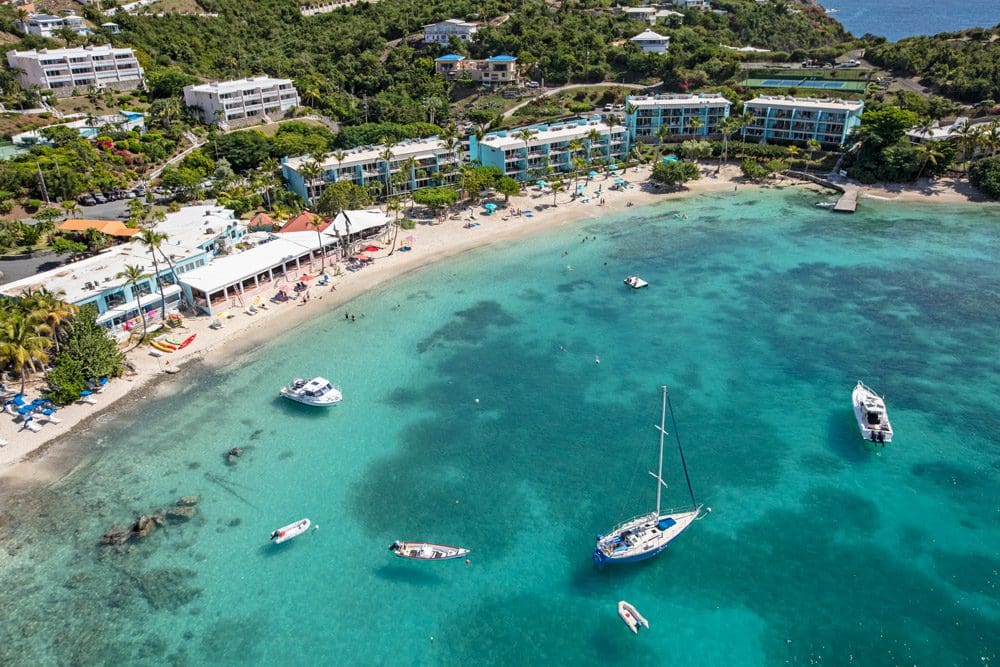 An aerial view of the resort grounds and expansive beach at Secret Harbour Beach Resort, one of the best US Virgin Islands resorts for families.