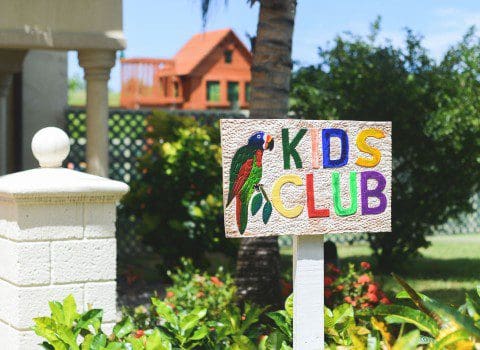 A sign with a parrot on it reads "Kids Club" at The Landings Resort.
