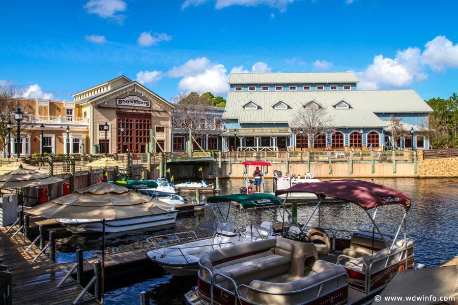 The small marina with resort buildings in the background at Disney's Port Orleans - Riverside, one of the best Disney moderate resorts for families.
