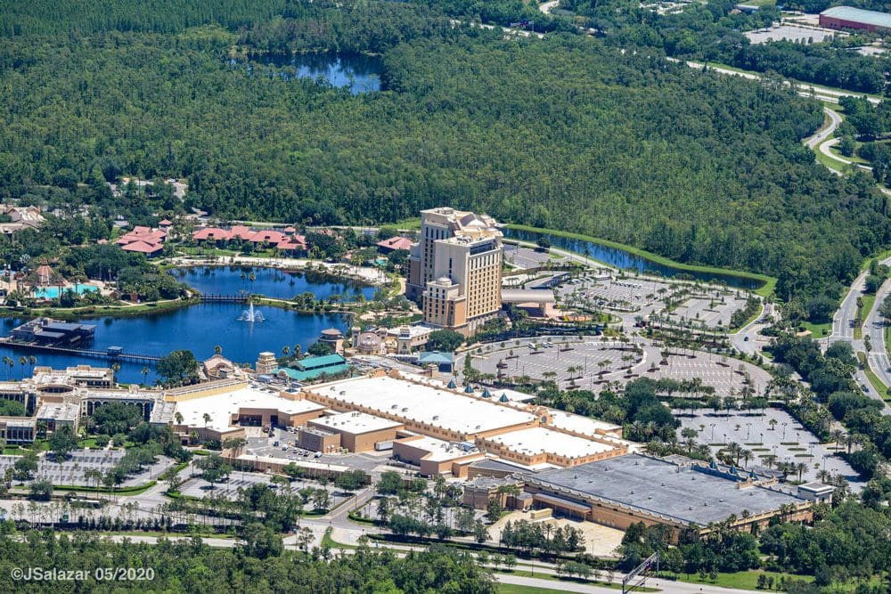 An aerial view of the resort grounds, including a large pool, at the Disney’s Coronado Springs Resort, one of the best Disney moderate resorts for families.