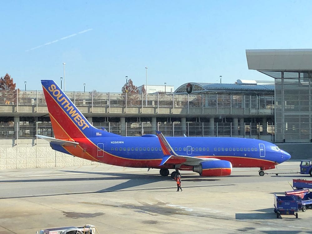A Southwest plane is parked at an airport.