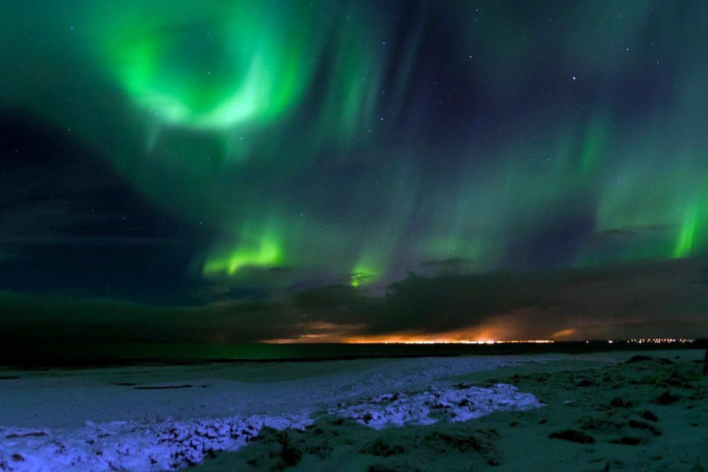 The northern lights in Iceland in hues of green and blue.