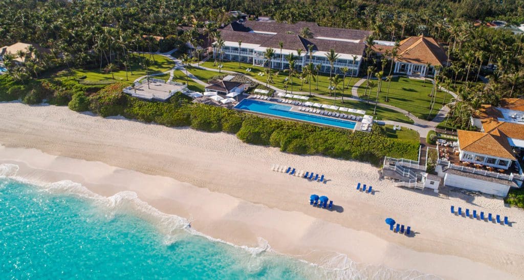 An aerial view of the beach and resort grounds at The Ocean Club, a Four Seasons property, one of the best hotels in the Bahamas for families.