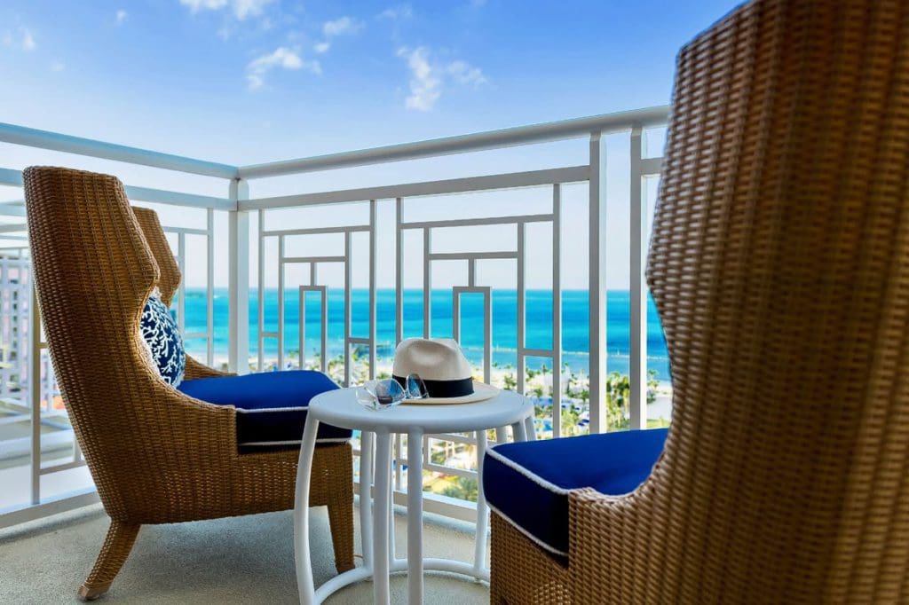 Two chairs on a balcony, over looking an oceanview at Grand Hyatt Baha Mar.