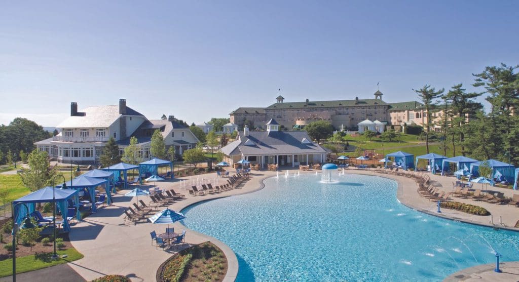 An aerial view of the outdoor pool and surrounding cabanas at Hotel Hershey, one of the best resorts in Pennsylvania for families.