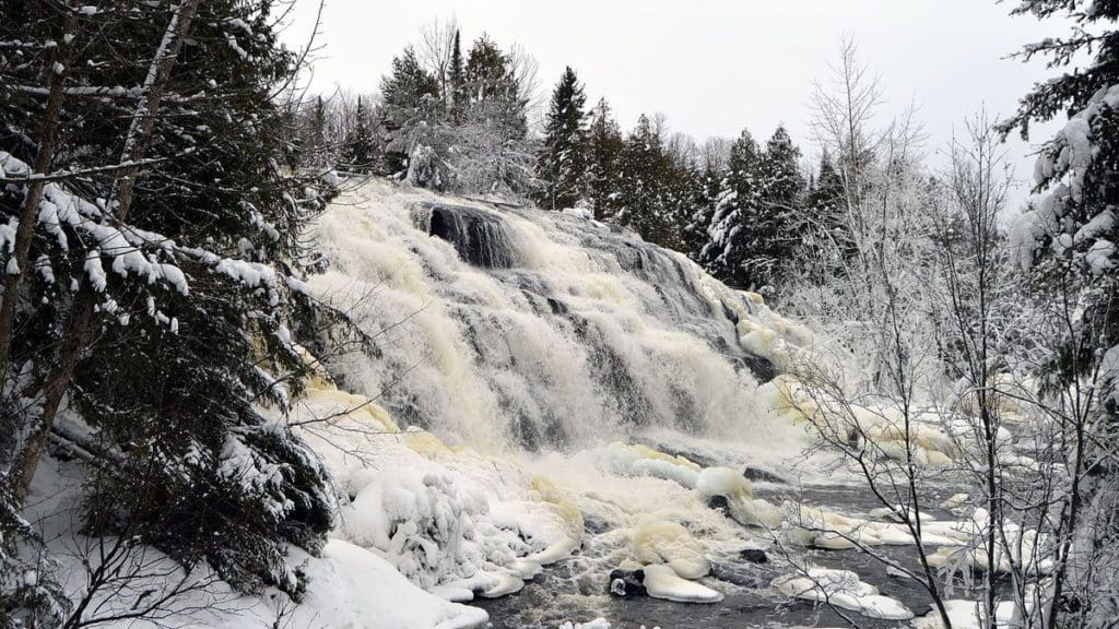A view of Bond Falls, frozen in the winter.