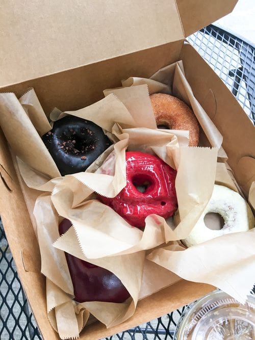 A box of various donuts from Blue Star Donut in Portland.