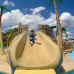 A young boy slides down a water slide, while staying at Beaches Ocho Rios Resort.