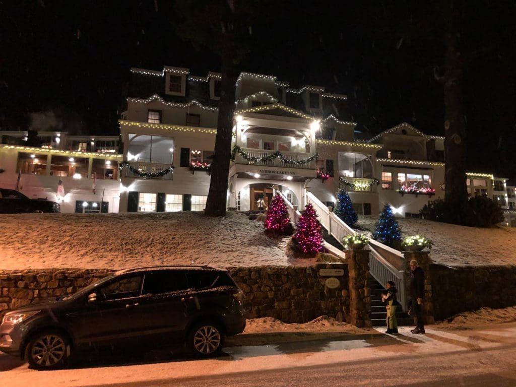 A view of the Mirror Lake Inn in Lake Placid on a wintery night.