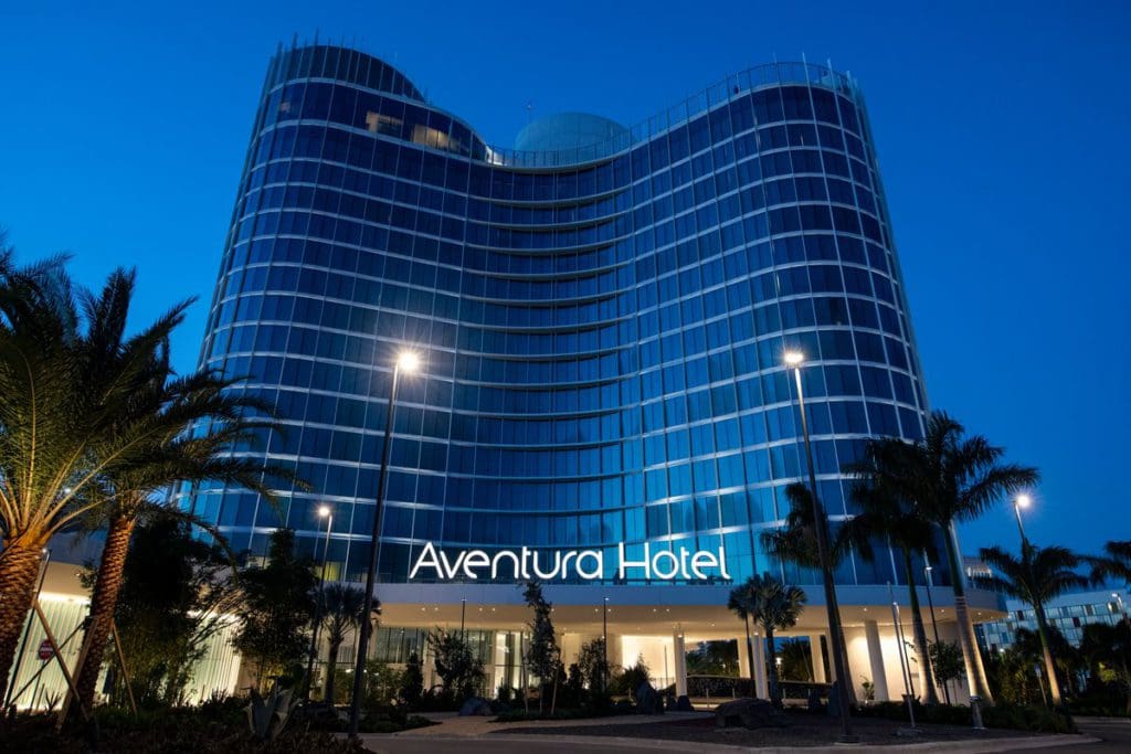 The exterior of the Aventura Resort at Universal Orlando at night.