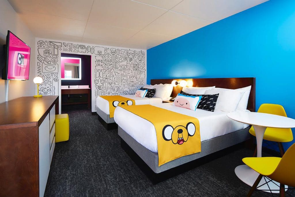 Inside one of the Cartoon Network-themed hotel rooms, featuring bright colors and cartoon drawings, at the Cartoon Network Hotel.