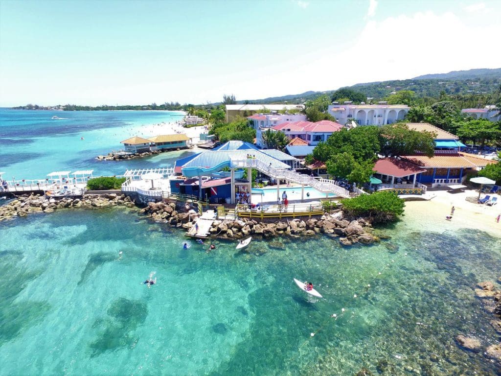 An aerial view of Franklyn D. Resort & Spa, featuring turquoise waters and a lovely beach. 