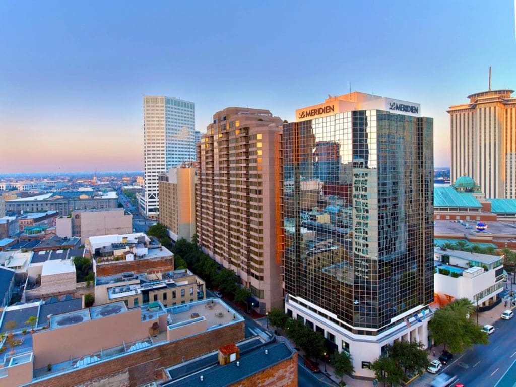 An aerial view of Le Méridien New Orleans within the New Orleans skyline, one of the best hotels in New Orleans for families.