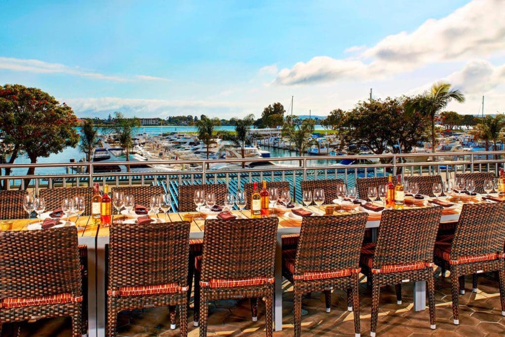 A long patio table on the terrace at the Marriott Marquis San Diego Marina, one of the Best Marriott Properties in the U.S. for a Family Vacation.