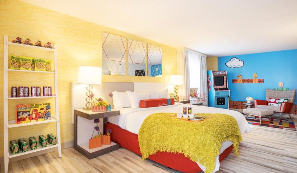 Inside one of the colorful rooms at The Curtis Hotel, featuring bright colors.