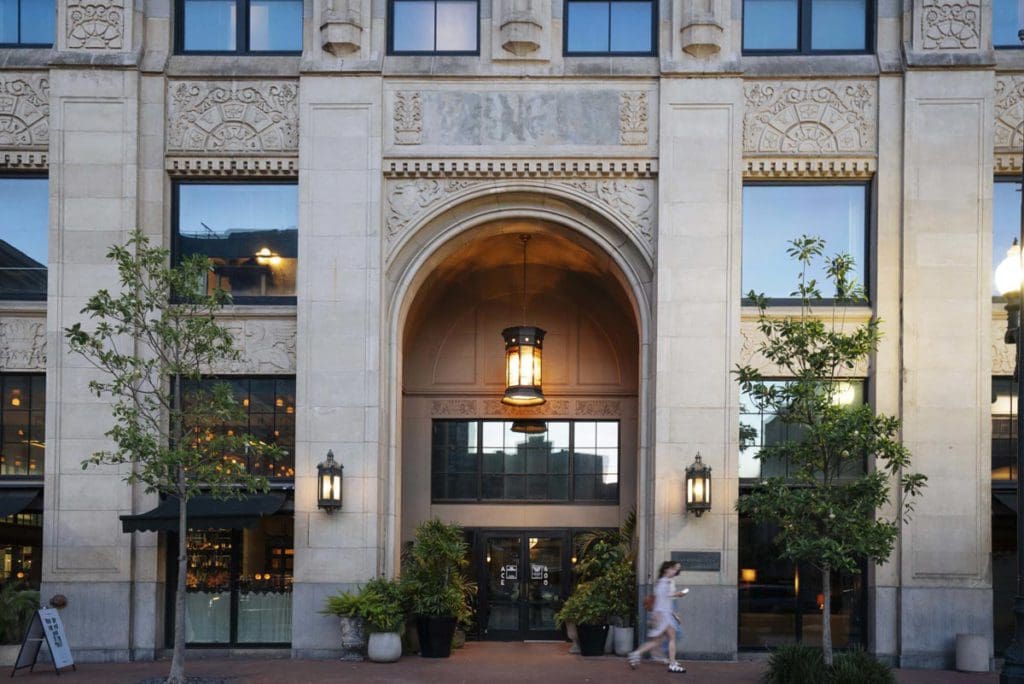 The huge, stone entrance to Ace Hotel, one of the best hotels in New Orleans for families.