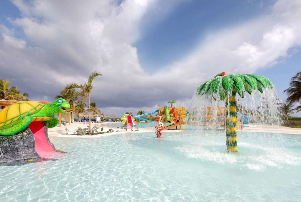 The on-site children's splash pad at the Grand Palladium Jamaica Resort & Spa, featuring brightly colored splash zones.