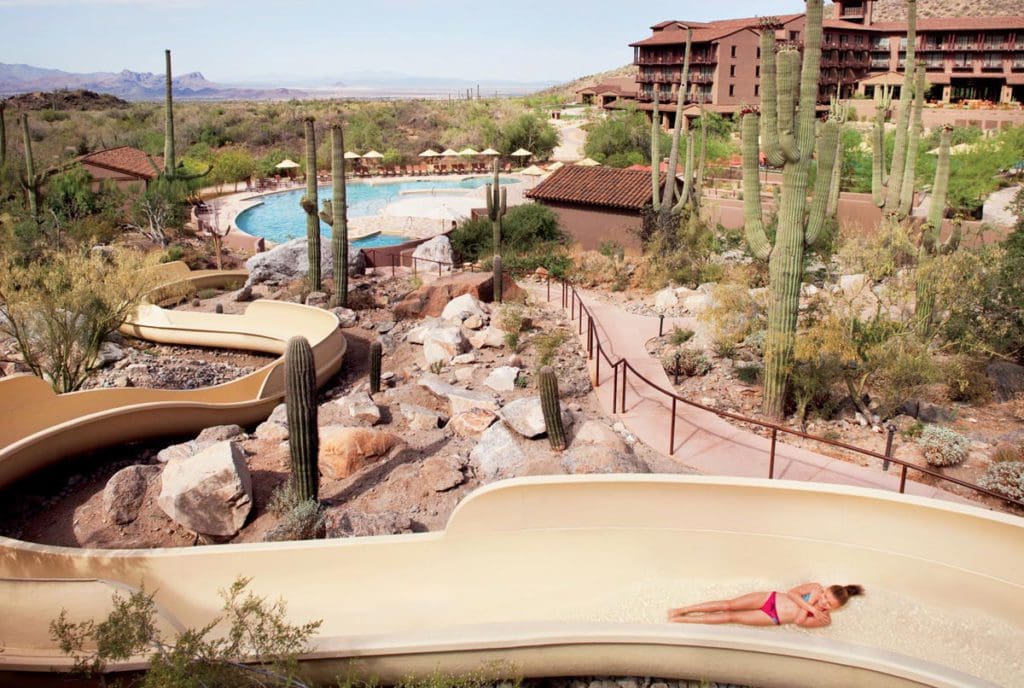 An aerial view of the water slide, pool, and resort grounds at The Ritz-Carlton, Dove Mountain.