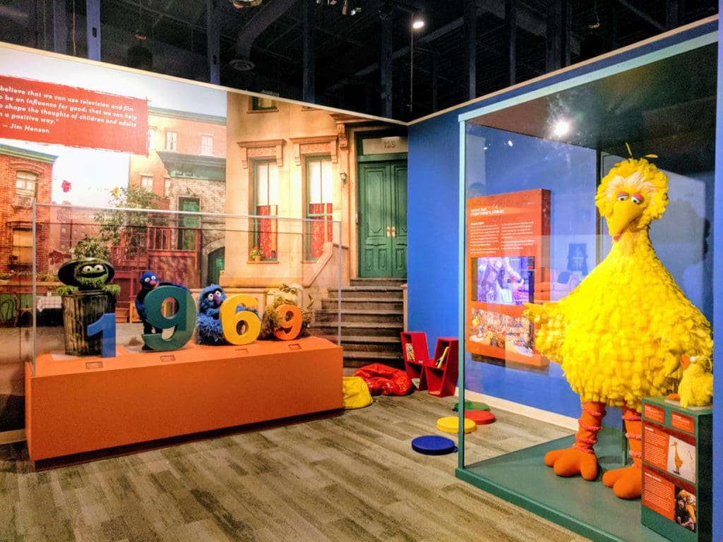 Inside an exhibit at the Center for Puppetry Arts, featuring Sesame Street characters like Big Bird and Oscar the Grouch.