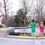 Two kids admire a fountain at Visit the Cheekwood Estate and Gardens.