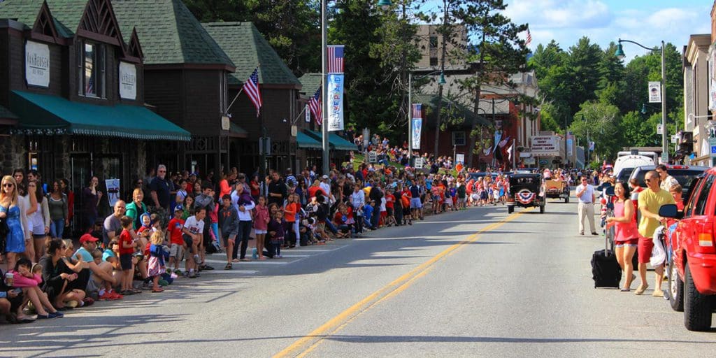 Families line the streets in Lake Placid to enjoy the fourth of July parade.