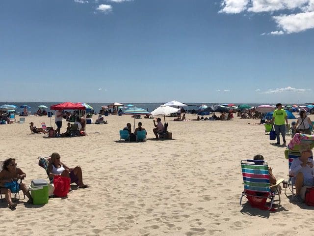 Several different families enjoy the sun and views at Ocean Beach.
