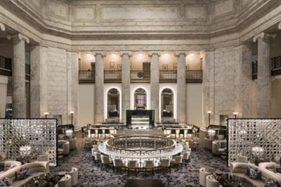 The historic lobby, featuring large columns and plush seating in Ritz-Carlton Philadelphia.