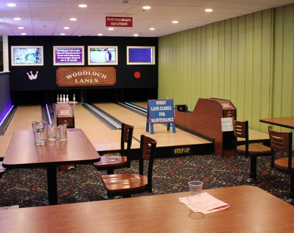 Inside the bowling alley at Woodloch Resort, looking down two lanes.