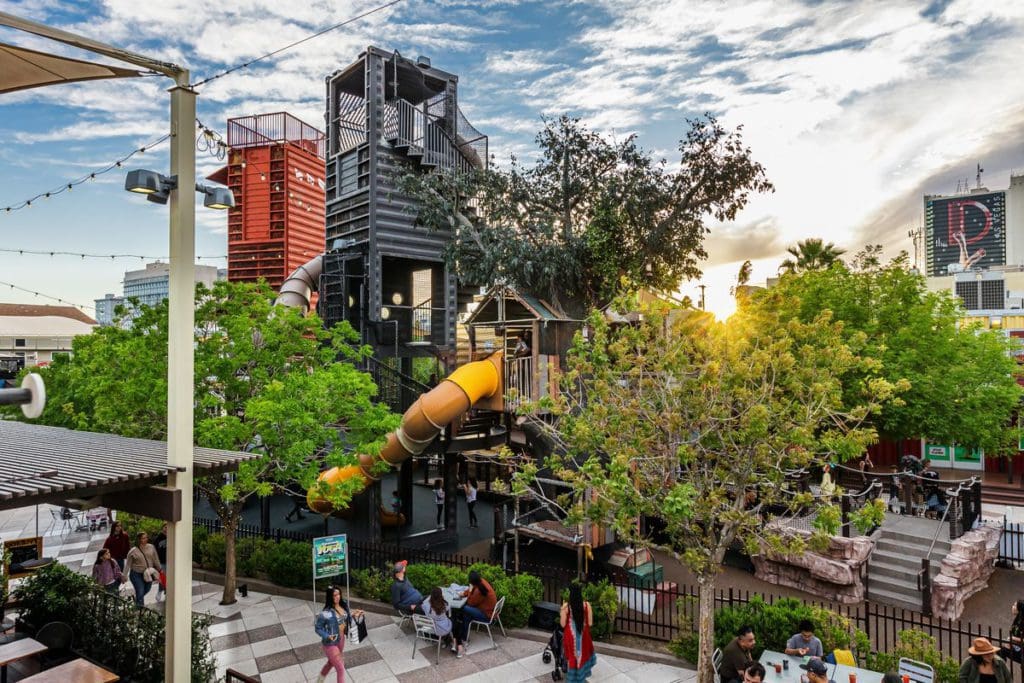 The large treehouse playground, with slides, seating, and huge containers at Container Park in Las Vegas, one of the best things to do in Las Vegas with kids.