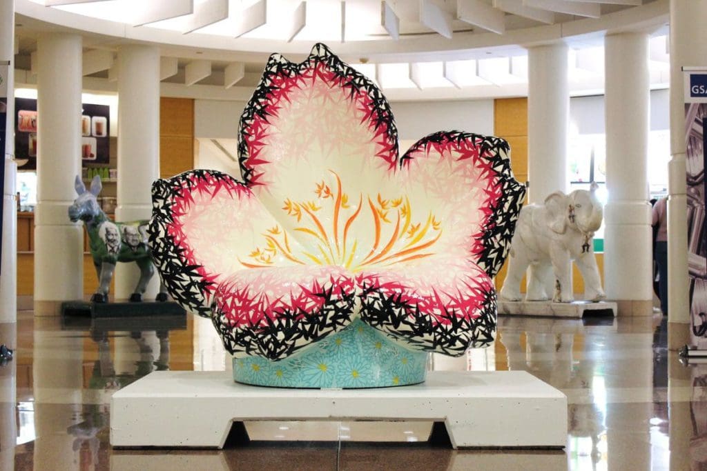 The art installation in the lobby of the Ronald Reagan Building and International Trade Center, featuring a large flower in vibrant colors.