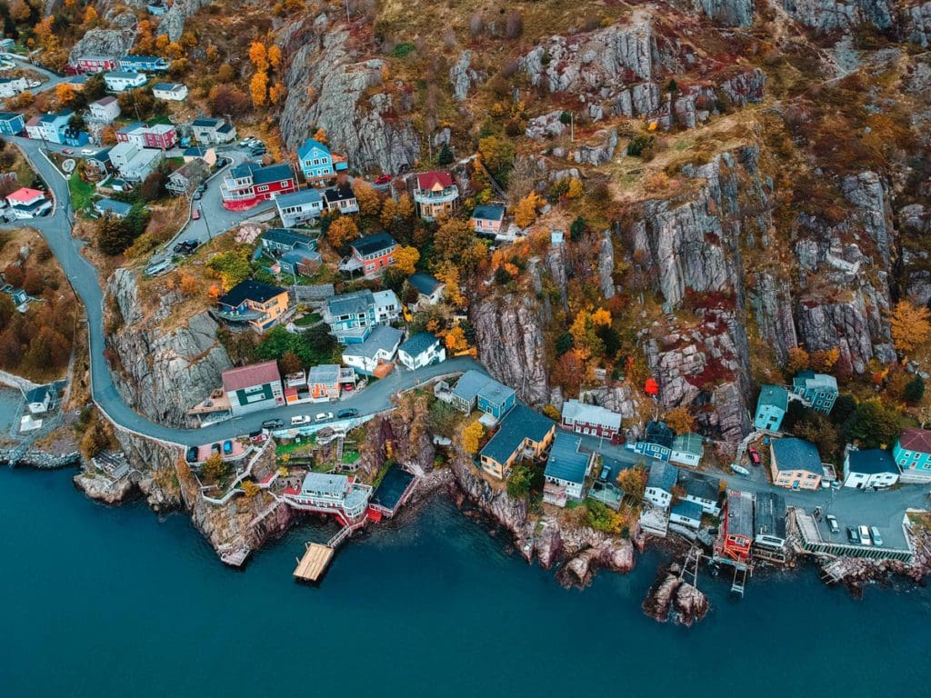 An aerial view of a colorful, seaside town in Newfoundland and Labrador.