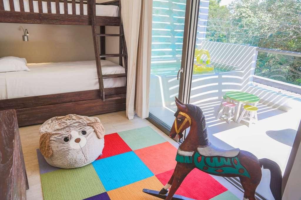 Inside the colorful kids' club, featuring small toddler toys, at Sandos Caracol Eco Resort.