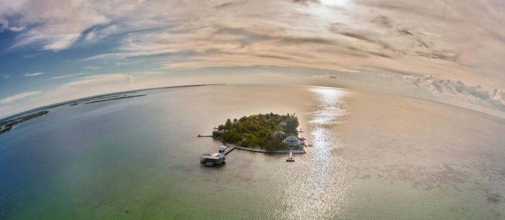 Drone footage of Cayo Espanto Island Resort at sunset.