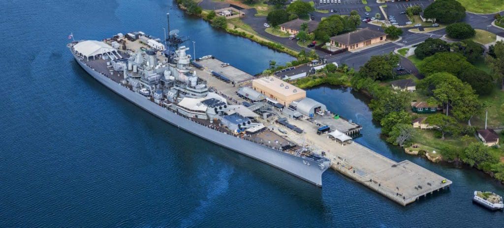An aerial view of a large naval ship at Pearl Harbor Historic Sites Visitor Center.