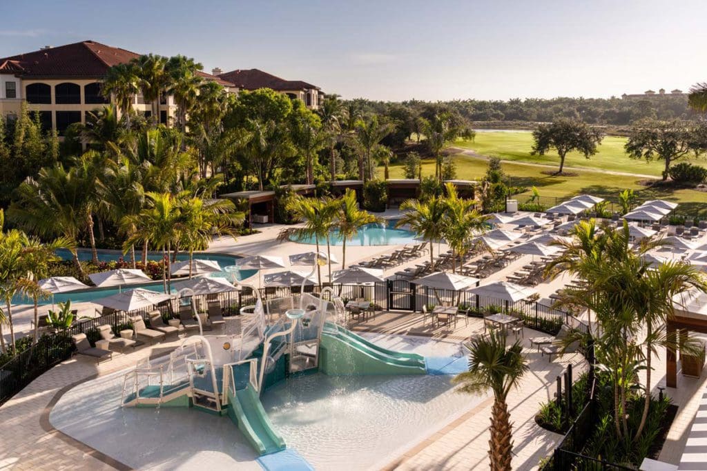 The small on-site splash pad and play area at The Ritz-Carlton Golf Resort, Naples, featuring slides and water features.