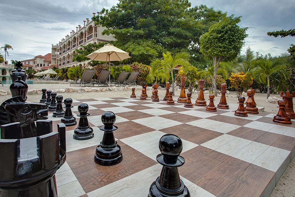 The life-size chess board at Coco Beach Resort, one of the best Belize resorts for a family vacation.