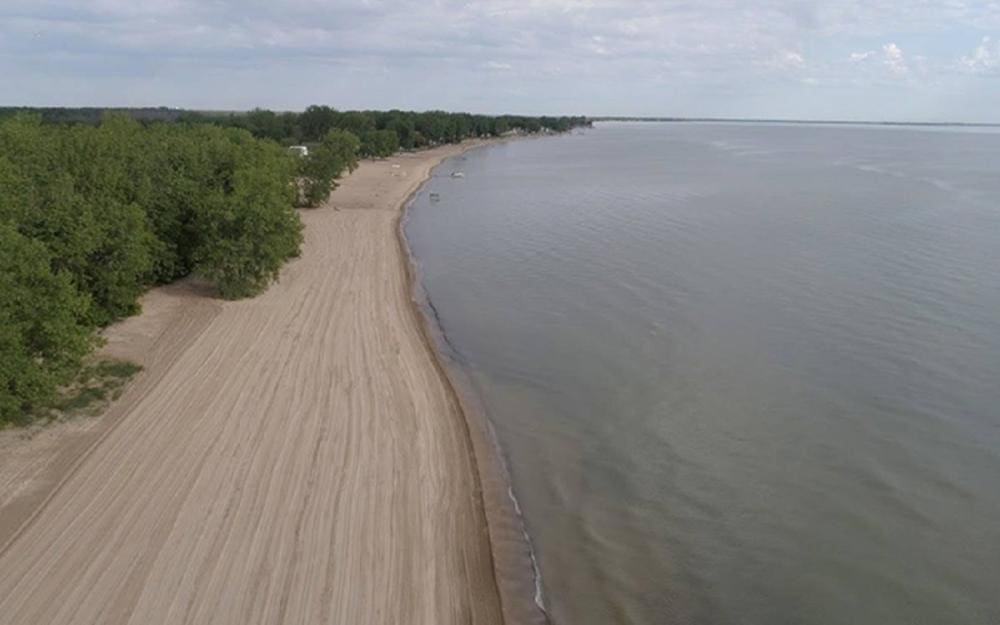 A long stretch of beach runs alongside Lake Michigan at Bay City State Park.