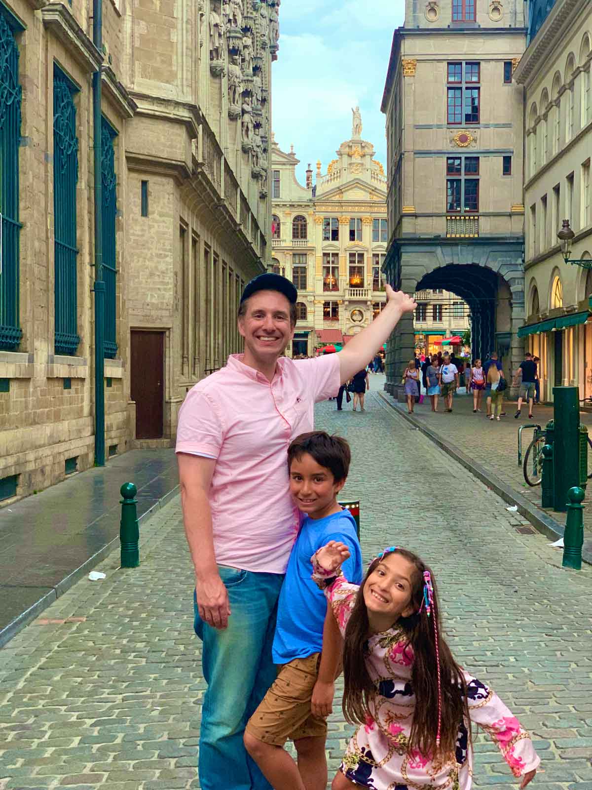 A family explores historic streets in Brussels.