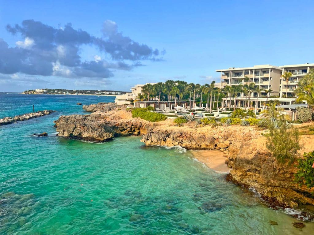 An aerial view of the property and ocean shoreline of Four Seasons Resort and Residences Anguilla.