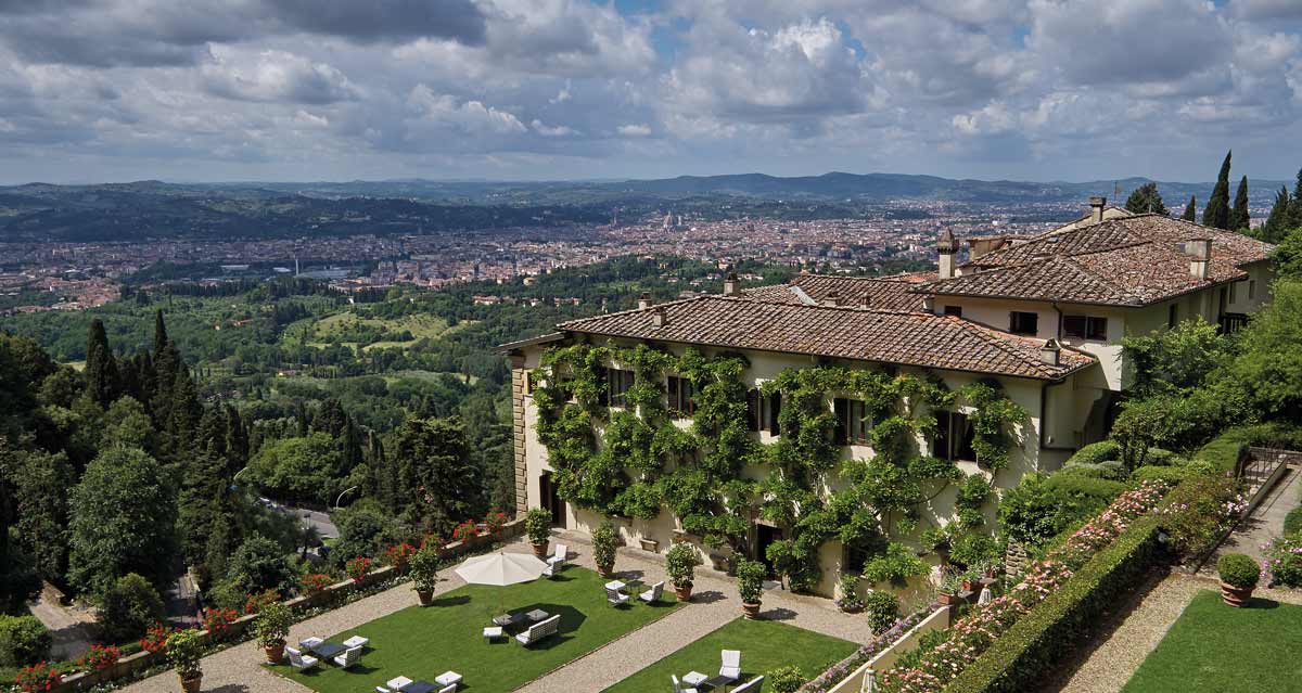 The lush outdoor space aside Belmond Villa San Michele, with a view of Tuscany below.
