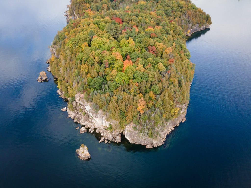An aerial view of Lake Champlain, covered in fall colors.