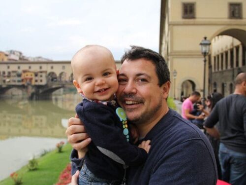 Father holding his baby in Florence Vacation Kidsi